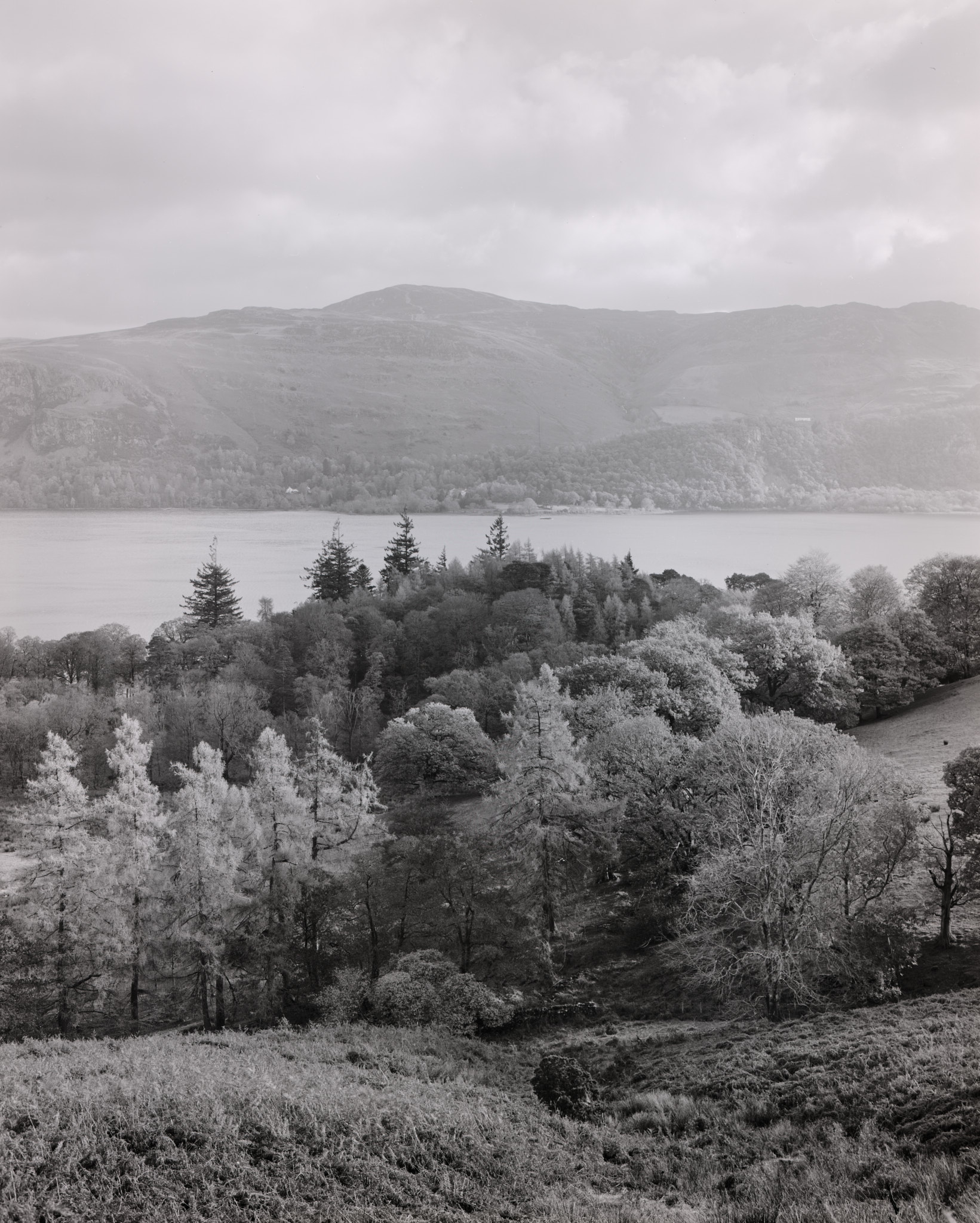 Scene across Derwent Water with a rain shower in the distance