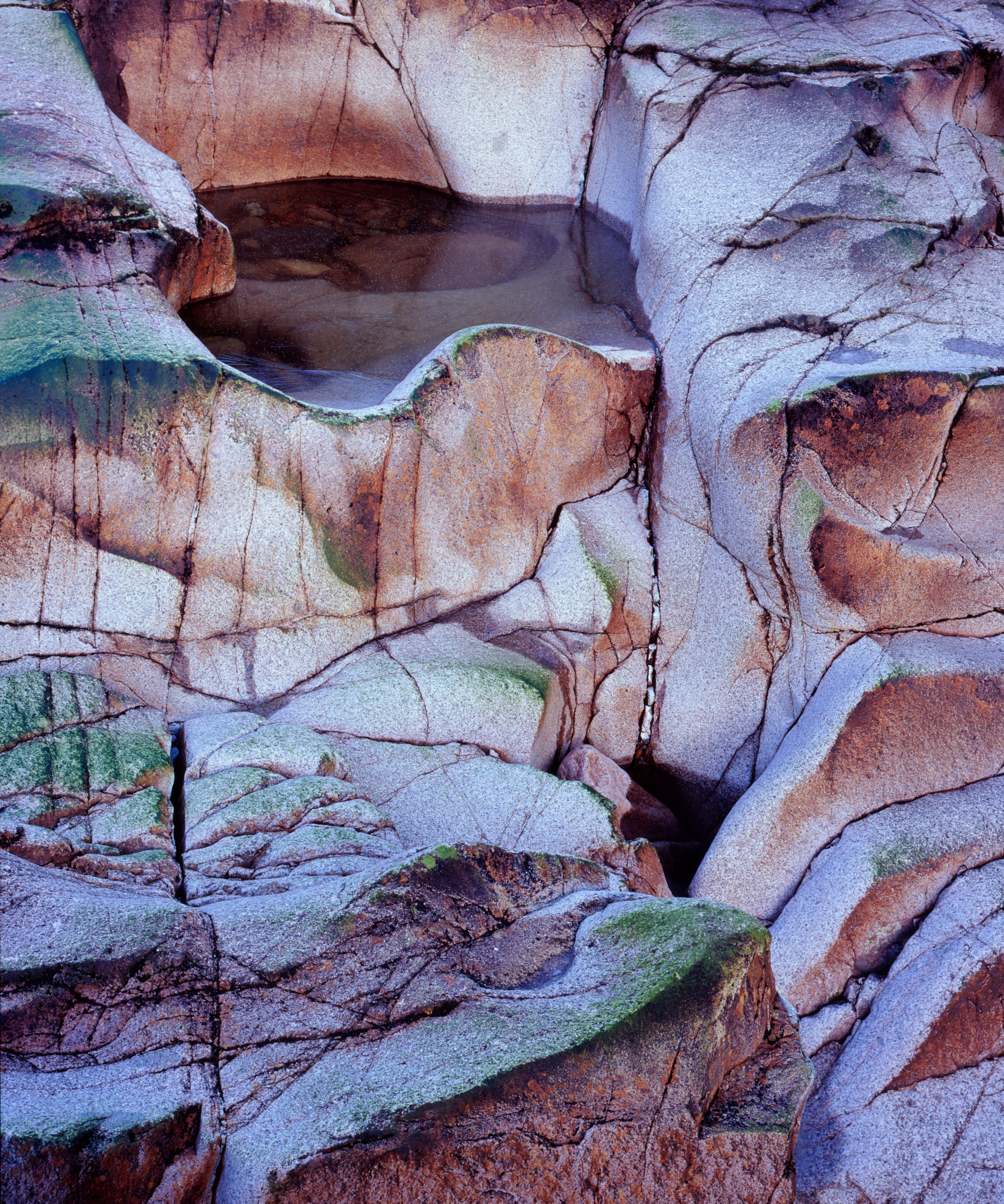 Sculpted granite and a frost-dusted rock pool in the River Etive