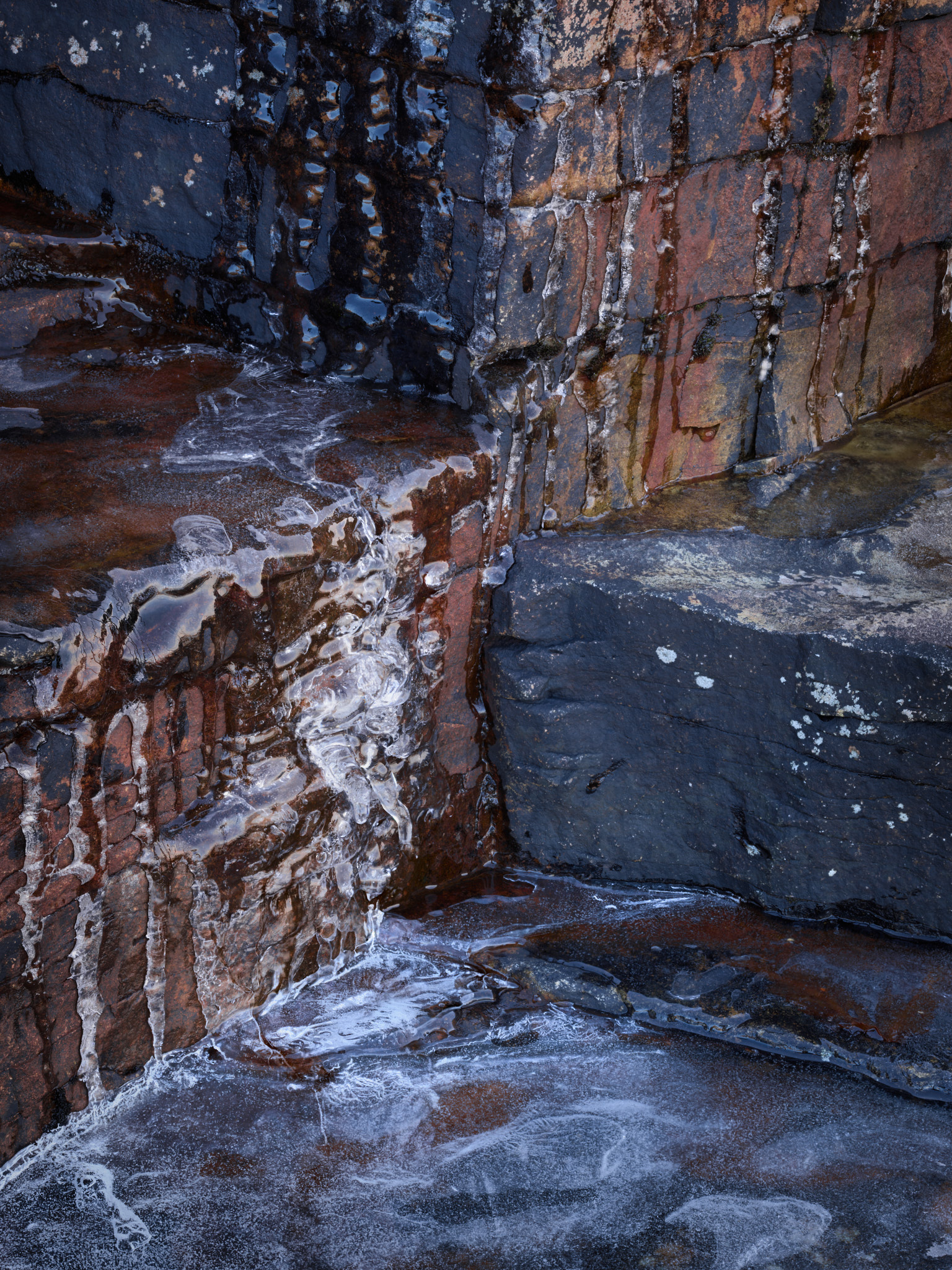 Image of Torridonian Rock covered in ice