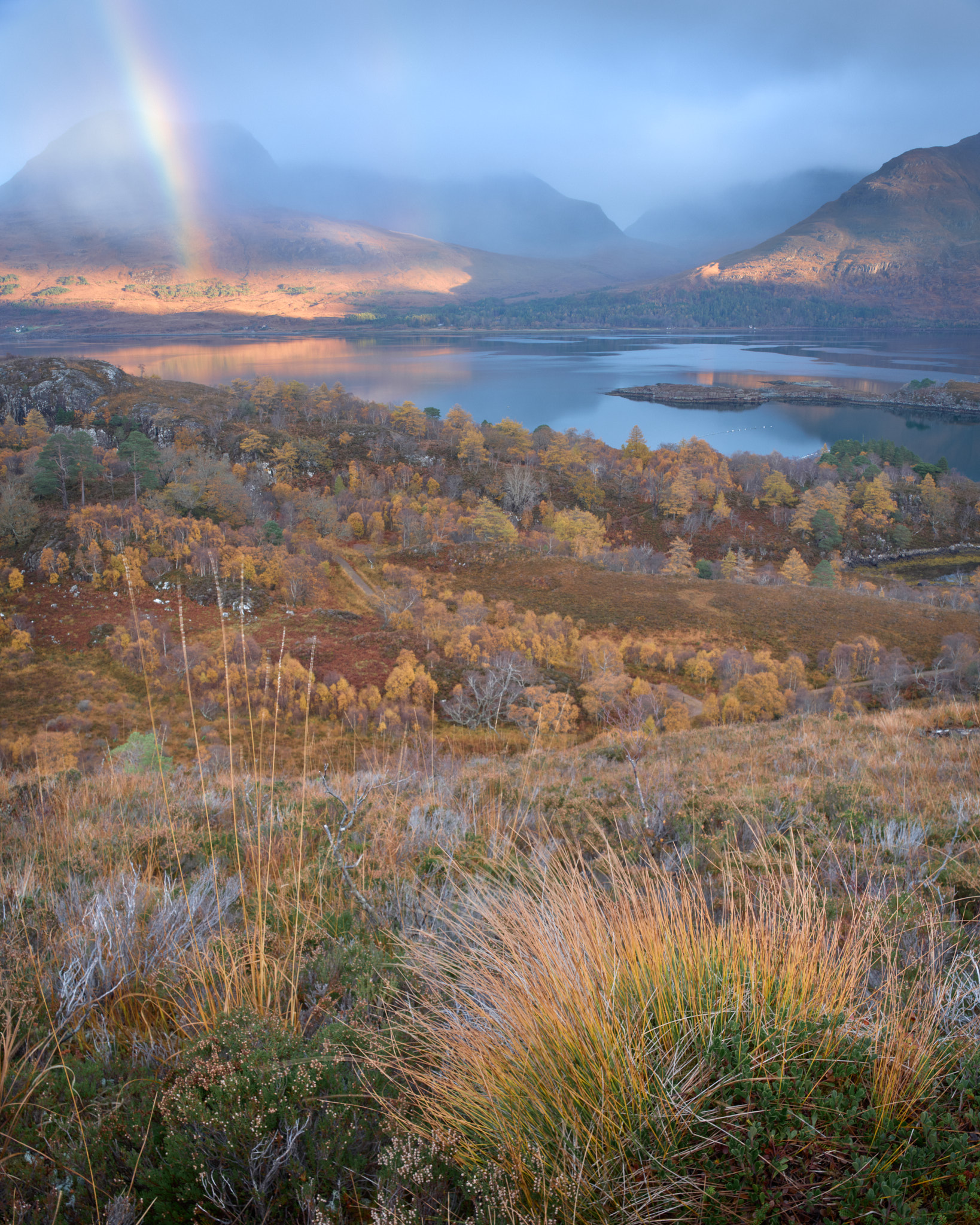 Mountain range in Torridon with a rainbow